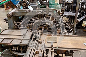 a very large machine in a building that has lots of tools on it photo