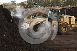 large industrial machinery being used at a garbage dump