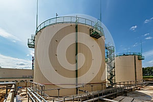 Large industrial round tanks for chemical production or oil. Construction of chemical factory