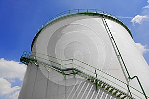 Large industrial silo with blue sky