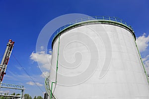 Large industrial silo with blue sky