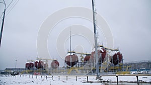 Large Industrial tanks for petrol and oil. Large tanks in the chemical factory. Large tanks for storing fuel are outside