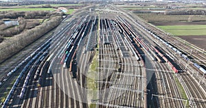 large industrial train depot, shipment and logistics over rail road track.