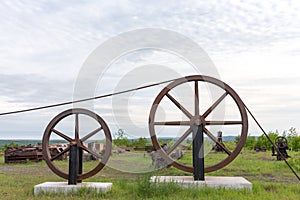 Large Industrial Wheels Holding a Cable