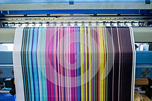 Large inkjet printer working multicolor on vinyl banner