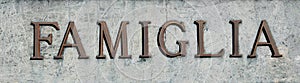 Large inscription with word FAMIGLIA that means FAMILY in Italia photo