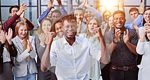 large international group of happy people applauding together