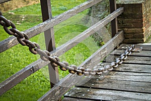 Large iron chain on an old castle bridge close up