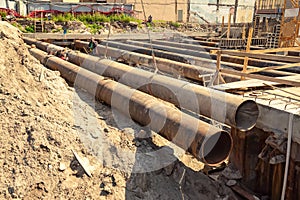 Large iron pipes at a construction site