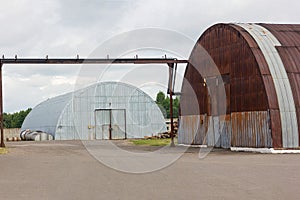 Large iron semicircular hangar. Modular semi-circular warehouse