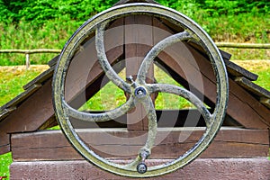 Large iron wheel for the well