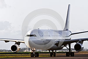 Large jet airliner taxiing on the runway