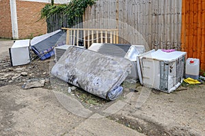 Large kitchen items dumped in an alleyway