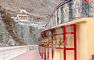 Large landmark Buddhist monastery with prayer wheels in India