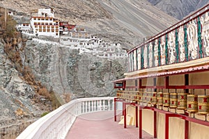 Large landmark Buddhist monastery with prayer wheels in India