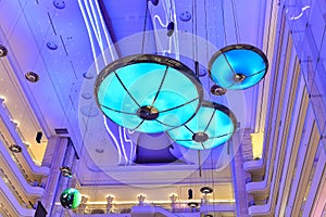 Large chandelier droplight ceiling lamp in modern commercial building hall photo