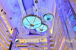 Large chandelier droplight ceiling lamp in modern commercial building hall photo