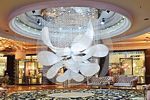 Led crystal chandelier lighting in hotel hall photo