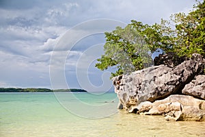 Large limestone rocks on Bagieng Island beach in the municipality of Caramoan, Camarines Sur Province, Luzon in the Philippines