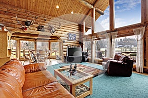 Large living room with diining area in log cabin house