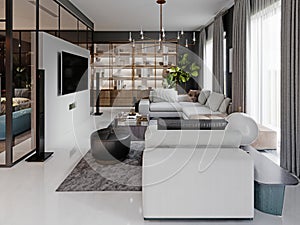 Large living room with a large white corner sofa and TV unit, dining area with dining table. Gray walls and large windows