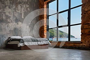 Large Loft Interior With Bed And Sea And Mountains In The Window
