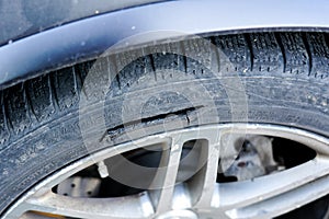 Large long mechanical cut damage on tire sidewall photo
