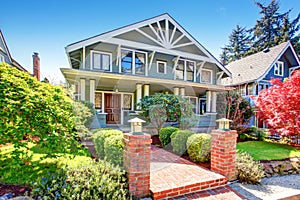 Large luxury blue craftsman classic American house exterior.