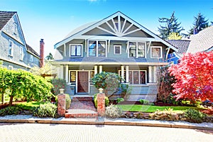 Large luxury blue craftsman classic American house exterior. photo