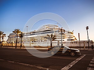 A large luxury cruise ship anchored in the harbor of Cadiz, Andalusia, Spain