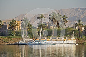 Large egyptian river cruise dahabeya boat moored on Nile