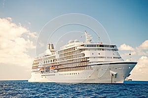 Large luxury white cruise ship liner at sea