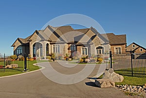 Large mansion with driveway.