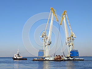 Large maritime cranes and boat