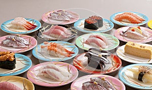 Large meal of shushi sashimi with shrimp, salmon, tuna, squid an