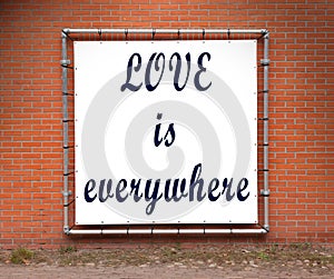 Large message written on a wall - Love is everywhere