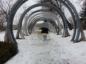 Large metal rings pathway in snow at Gongjicheon in Chuncheon