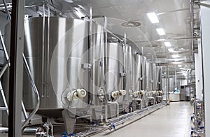 Large metal vats for fermentation of wine factory