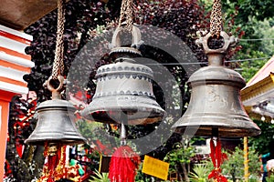 Large metallic bells in Naina Devi Temple at Nainital, India photo