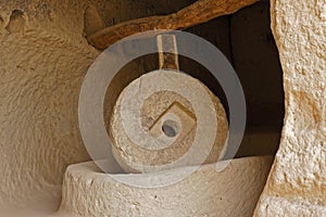 Large millstone in cave, Zelve Valley, Cappadocia, Turkey