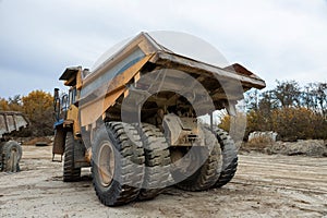 Large mining dump truck. Transport industry. Extraction of stone in an open pit