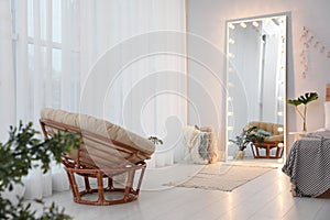 Large mirror with light bulbs in room interior