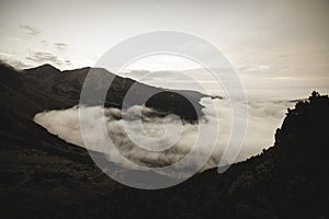 Large misty cloud climbing mountain valley in slovakia, Tatra - vintage retro look