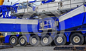 Large mobile crane with multiple wheels and operator cab