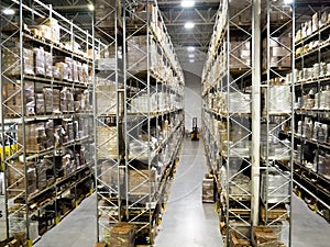 Large modern blurred warehouse industrial and logistics companies. Warehousing on the floor and called the high shelves