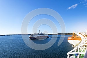 Large modern cruise ship in the sea. Beautiful white giant luxury cruise ship at harbor. Colorful landscape with boats in marina b