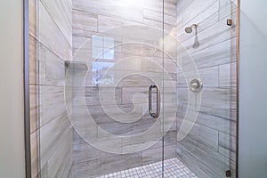 Large modern tiled shower cubicle bright interior