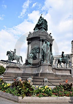 Large monument dedicated to Marie Teresa, with flower cushion, in the center of the park of the museum district, in Vienna.