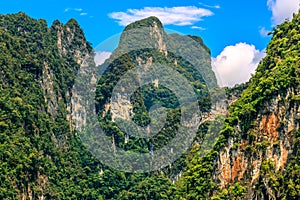 Large mountain with many peak and blue sky.