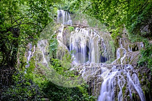 A large mountain waterfall walking on top of a cliff 2